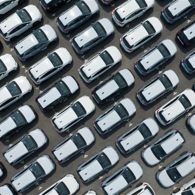 aerial-view-of-new-cars-stock-at-factory-parking-l-2023-11-27-05-13-55-utc (1)